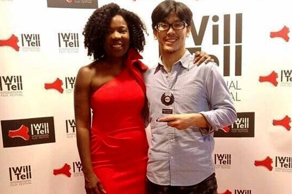 Home 18 Festival organiser Jenny Lee with a movie director at the I Will Tell international feature film Festival in the UK.
