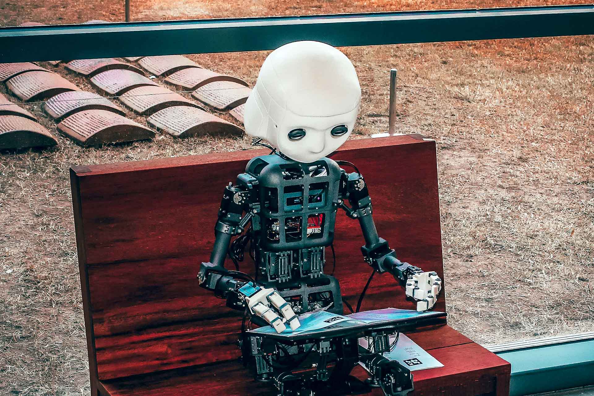 Workshops 1 AI animation robot sitting reading a story.