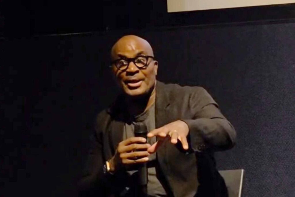 Home 73 Robert Beckford taking questions and speaking on stage.